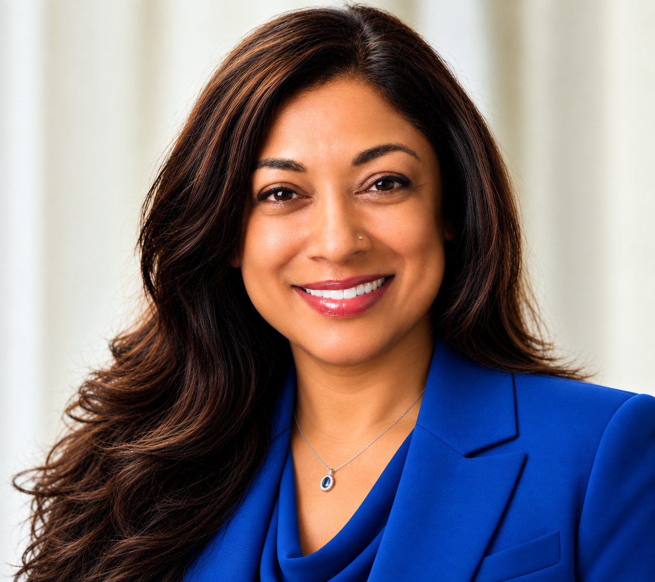 Smiling professional woman in blue blazer